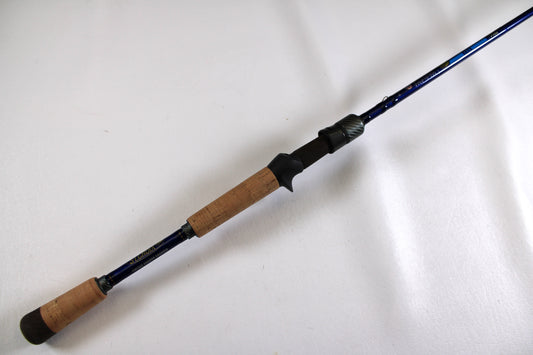 A close-up of the St. Croix Legend Tournament Bass LBTC72MHMF Finesse Carbon Cranker 7'2" MH Used Casting Rod in excellent condition, ideal for our Rod and Reel Trade-In Program. Set against a plain white background.