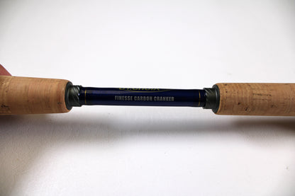 A close-up of the St. Croix Legend Tournament Bass LBTC72MHMF Finesse Carbon Cranker 7'2" Medium Heavy Used Casting Rod—excellent condition, cork grips, and ideal for our Rod and Reel Trade-In Program if you want to update your gear.