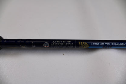 Close-up of a blue St. Croix Legend Tournament Bass LBTC74MHM Power Glass Cranker 7'4" Med-Heavy Casting Rod, Used in Excellent Condition, with "MODERATE ACTION" and USA logo visible on a white background.