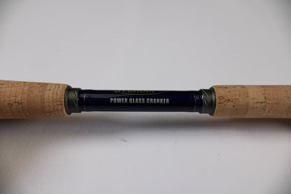 A close-up of the St. Croix Legend Tournament Bass LBTC74MHM Power Glass Cranker 7'4" Medium Heavy used casting rod with cork grips—eligible for our Rod and Reel Trade-In Program for store credit on excellent condition gear.