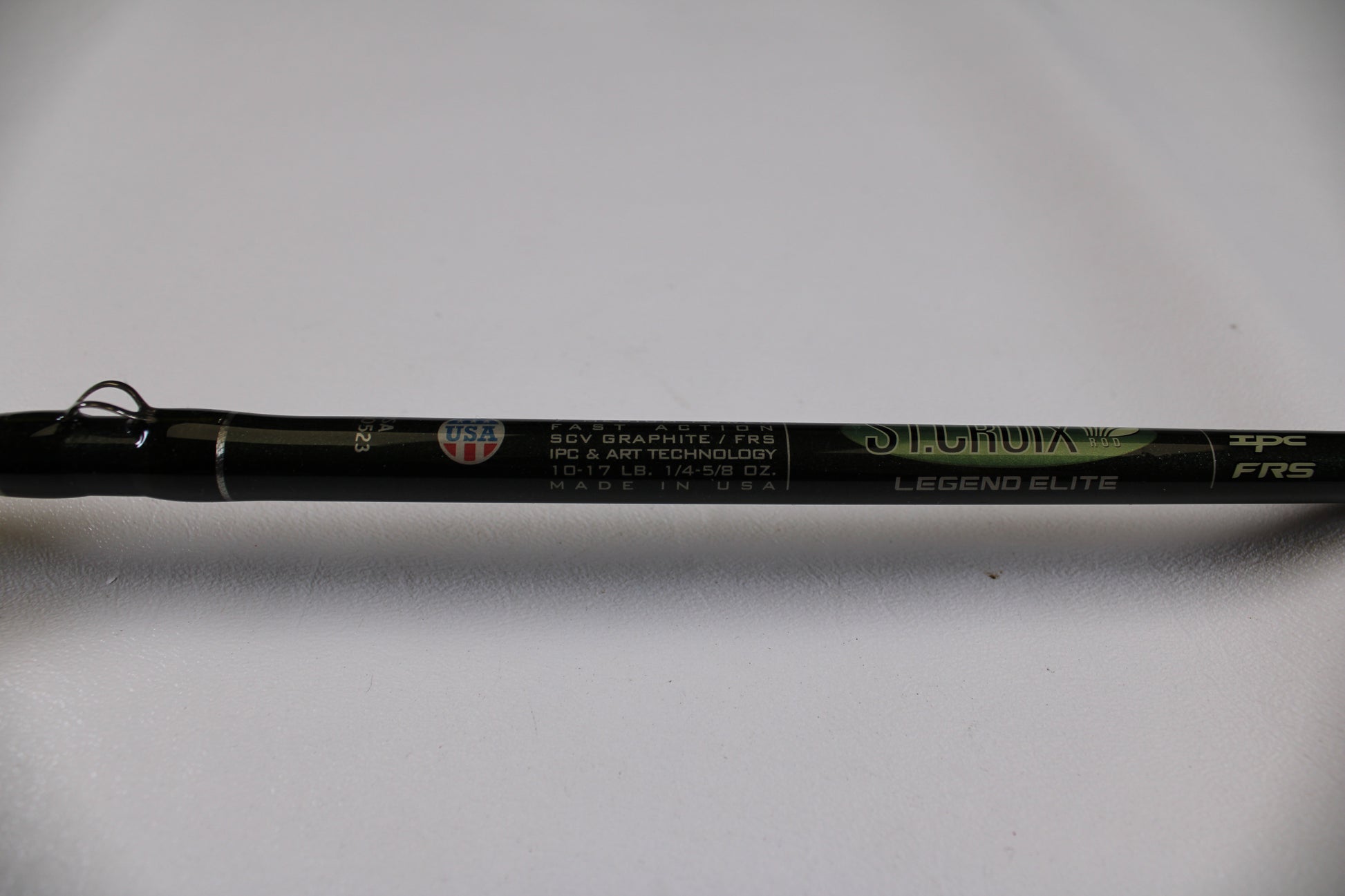 A close-up of a used St. Croix Legend Elite EC70MF 7'0" Medium casting rod in excellent condition shows details like "SCV graphite/FRS" and "10-17 LB, 1/4-5/8 OZ." Eligible for our Rod and Reel Trade-In Program for store credit.