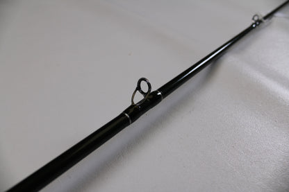 A close-up of a St. Croix Legend Elite EC70MF 7'0" Medium used casting rod in excellent condition, highlighting a line guide—ideal for those interested in quality used gear or our Rod and Reel Trade-In Program.