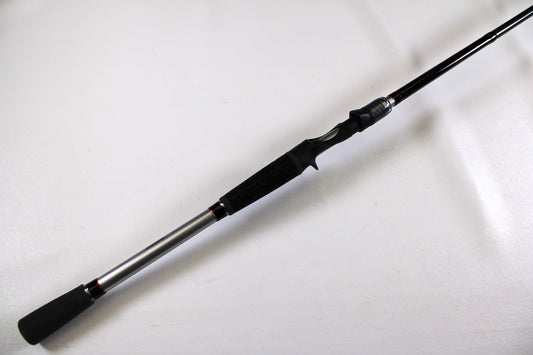The Shimano Intenza NTZC78XH 7'8" XH Used Casting Rod, in excellent condition, is displayed diagonally on a plain white background. The rod features black and silver accents with a black grip handle.
