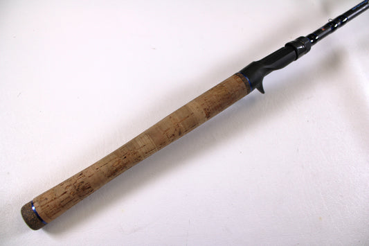 A close-up of the Dobyns Champion XP DC736CBGLASS 7'3" Heavy Used Casting Rod in very good condition, perfect for upgrading through our Rod and Reel Trade-In Program or for store credit on used Dobyns gear. Shown on a plain white background.