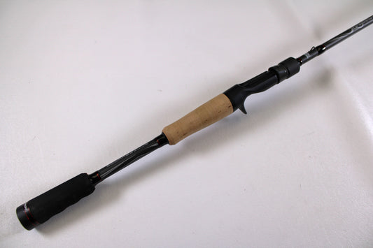 The Abu Garcia Winch WINCHC70-6 7'0" Medium Heavy Used Casting Rod in excellent condition lies diagonally on a white surface—ideal for trade-in through our Nation's Best Rod and Reel Trade-In Program for store credit.