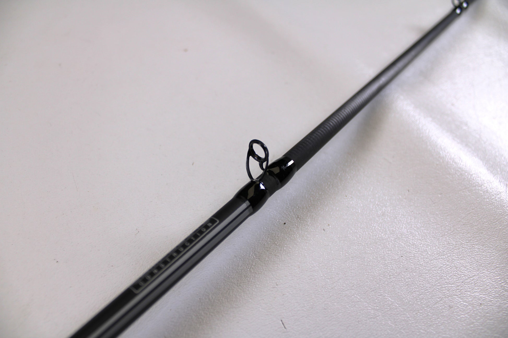 Close-up of an Abu Garcia Winch WINCHC70-6 7'0" Medium Heavy Used Casting Rod in excellent condition, with a visible guide ring—ideal for those joining the Nation's Best Rod and Reel Trade-In Program.