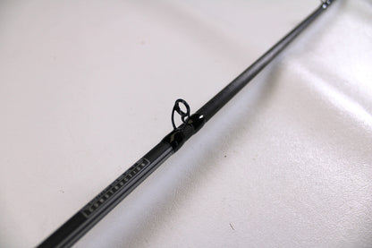 Close-up of a used Abu Garcia Winch WINCHC70-5 7'0" Medium Casting Rod in excellent condition, highlighting a line guide—perfect for the Nation's Best Rod and Reel Trade-In Program.