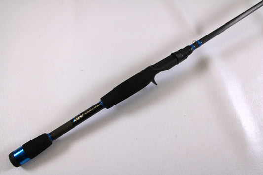 The Alpha Angler Slasher 6'10" Medium Used Casting Rod, in excellent condition with a foam handle and trigger grip, is perfect for upgrading through our rod and reel trade-in program or exploring quality used gear.