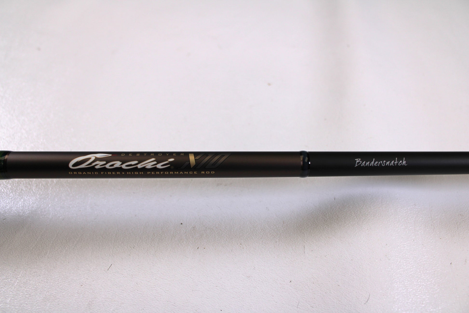 A close-up of the Megabass Orochi X10 F5-70XT Bandersnatch 7'0" Medium Used Casting Rod in excellent condition, ideal for those trading in gear through our Rod and Reel Trade-In Program for store credit.