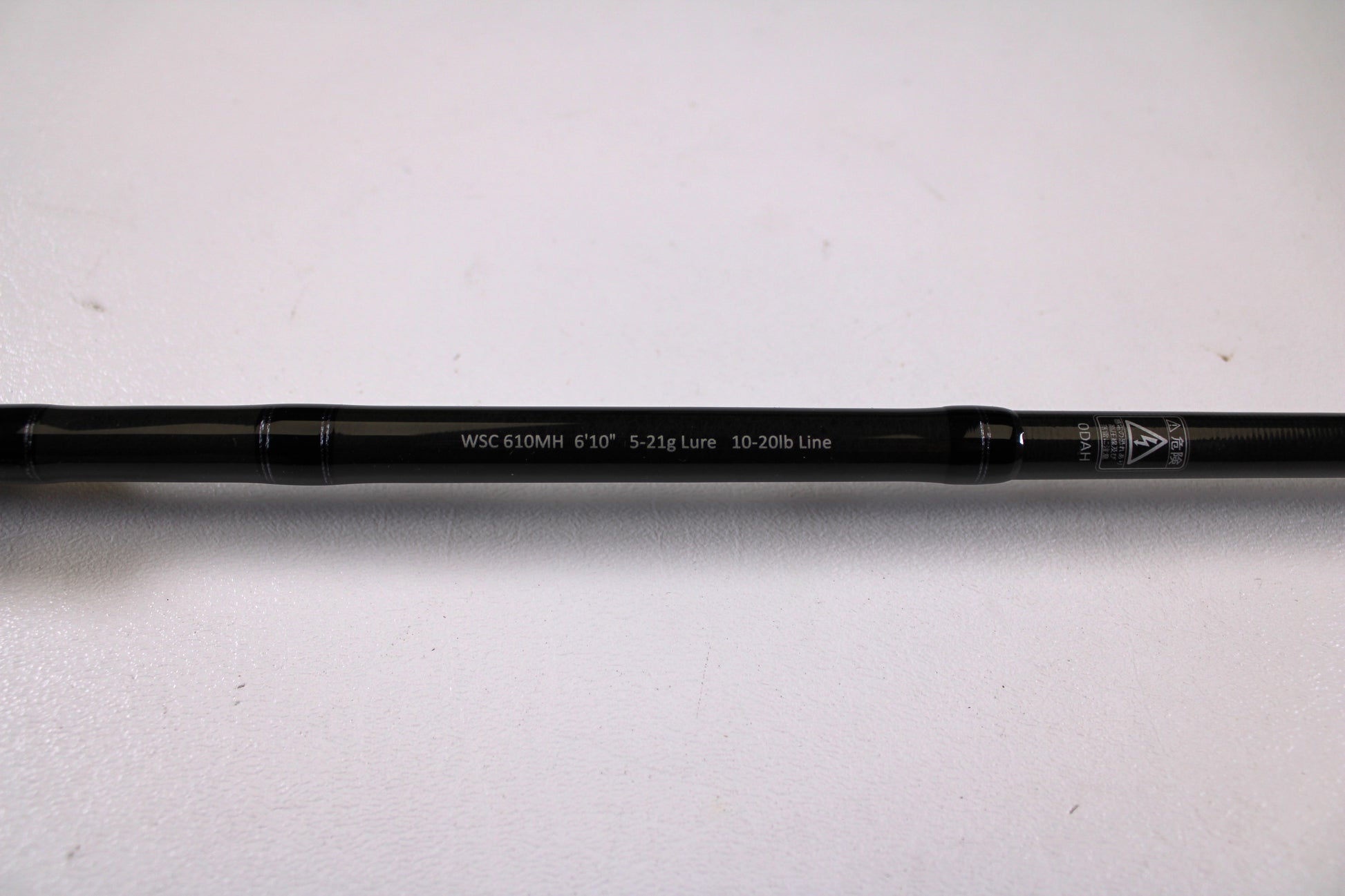 A close-up of a Legit Design Wild Side WSC 610MH 6'10" Medium Heavy Used Casting Rod in excellent condition, with specs "5-21g Lure, 10-20lb Line" shown, ideal for trade-in program fans, set against a plain white background.