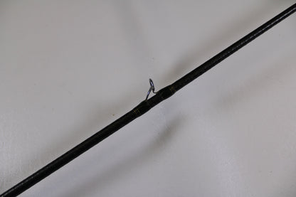 A close-up of a Megabass Orochi XX Aaron Martens F4.1/2-68XX Jerkbait Special used casting rod in fair condition highlights a single metal guide ring—ideal for those interested in used gear or our Rod and Reel Trade-In program.