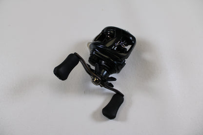 A Daiwa Tatula SV 70 TTUSV70XH Used Casting Reel in excellent condition is displayed on a white surface—ideal for our Rod and Reel Trade-In Program if you want to upgrade your gear and earn store credit.