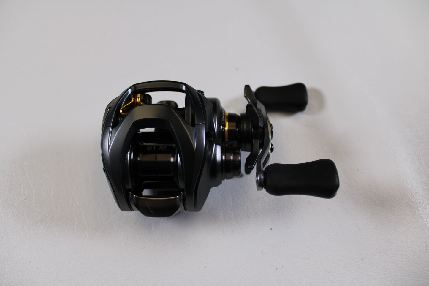 A Daiwa Steez SV TW 1016SV-H 6.3:1 RH casting reel in excellent used condition sits on a white surface—ideal for those exploring our Rod and Reel Trade-In Program or quality Used Gear Condition options.
