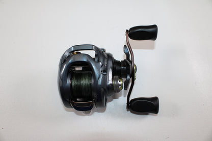 Upgrade with our Rod and Reel Trade-In Program or earn store credit on used gear—like this Daiwa Zillion SV TW JDM 9.1:1 Gear Ratio casting reel (used, good condition) by Daiwa, shown with black handles and green line on a white background.