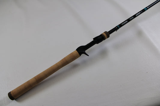 A close-up of a G. Loomis NRX+ 904C MBR Used Casting Rod in excellent condition—ideal for those exploring the Rod and Reel Trade-In Program for store credit.