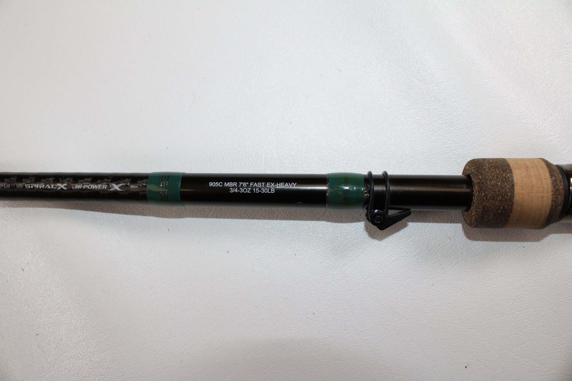 A close-up of a G. Loomis Conquest CNQ 905C MBR Used Casting Rod handle and shaft, in very good condition, against a white background—ideal for the Rod and Reel Trade-In Program or expanding your used gear collection.