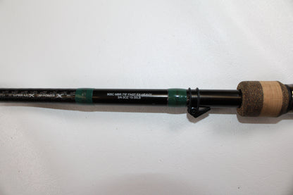 A close-up of a G. Loomis Conquest CNQ 905C MBR Used Casting Rod handle and shaft, in very good condition, against a white background—ideal for the Rod and Reel Trade-In Program or expanding your used gear collection.