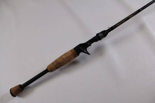 The Falcon Cara T7 CC-5-167S Weightless Worm Used Casting Rod, in good condition, features a cork handle and black reel seat, making it a lightweight choice for freshwater anglers and ideal for our Rod and Reel Trade-In Program.