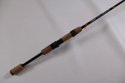 The G. Loomis GCX Lite 780S SR Used Spinning Rod—Excellent Condition—features a cork handle and black reel seat, ideal for upgrading through our Rod and Reel Trade-In program to get store credit for your used gear.