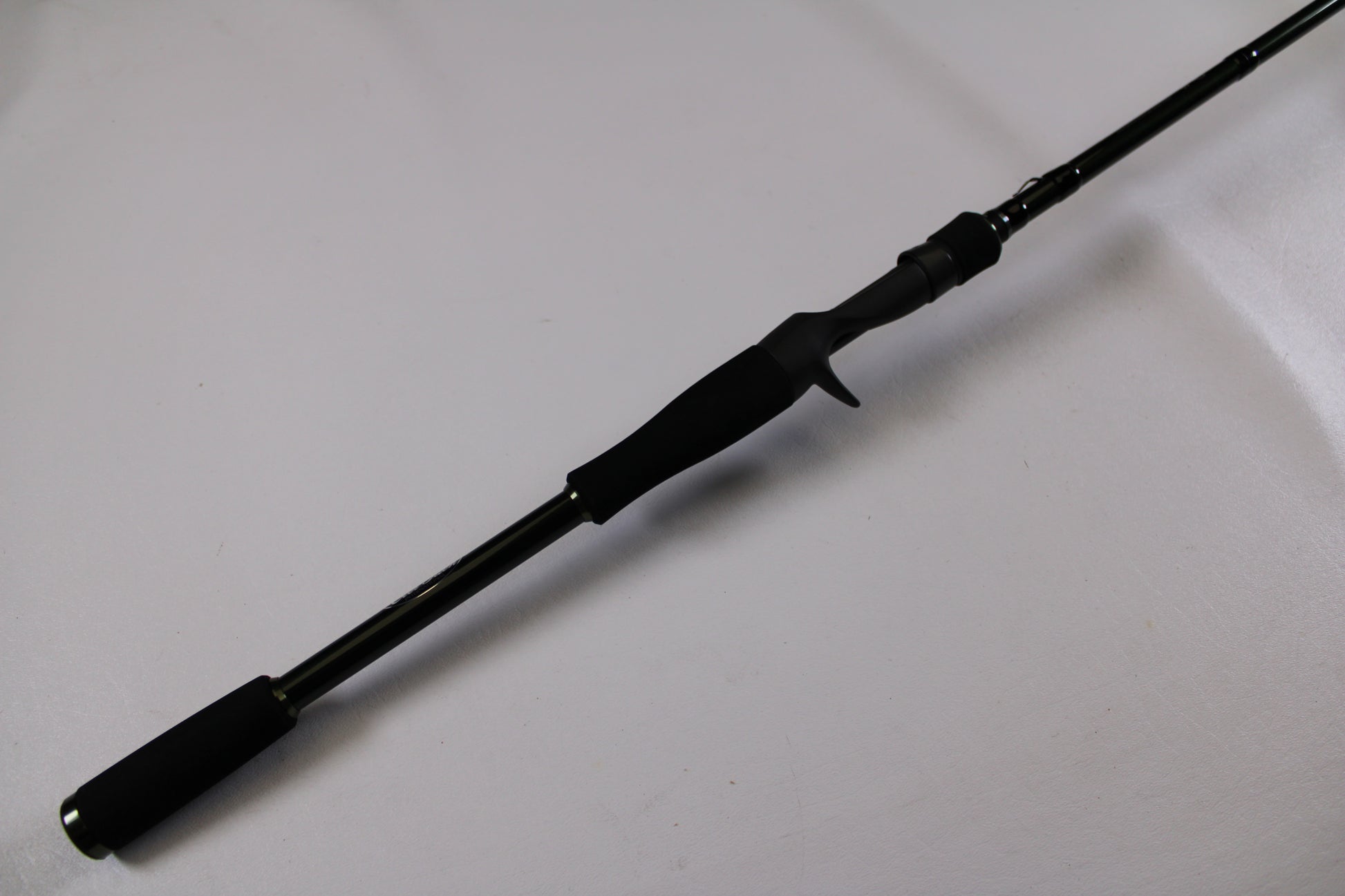 The Evergreen Combat Stick RCTC-73MH Used Casting Rod (Excellent Condition) features a foam handle and trigger grip—perfect for upgrading via our Rod and Reel Trade-In Program or earning store credit on used gear.