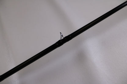 A close-up of the Evergreen Combat Stick RCTC-78XH—Used Casting Rod in excellent condition, featuring a metal guide ring against a plain white background—ideal for those trading in used gear for store credit or the Rod and Reel Trade-In Program.