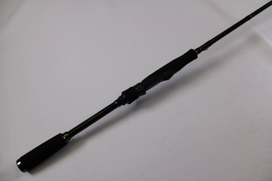 The Evergreen Combat Stick RCTS-610MST Used Spinning Rod in excellent condition is displayed diagonally on a white surface, ideal for assessing its quality for our Rod and Reel Trade-In and earning used gear store credit.