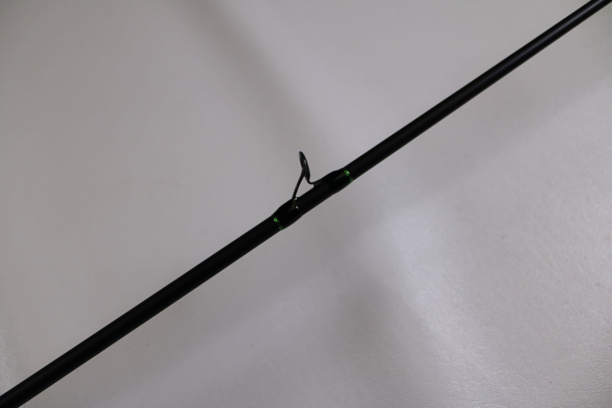 A close-up of the G. Loomis IMX-PRO 782c MBR 6'6" Medium Used Casting Rod in excellent condition, set against a light background—perfect for assessing quality at our Rod and Reel Trade-In event.