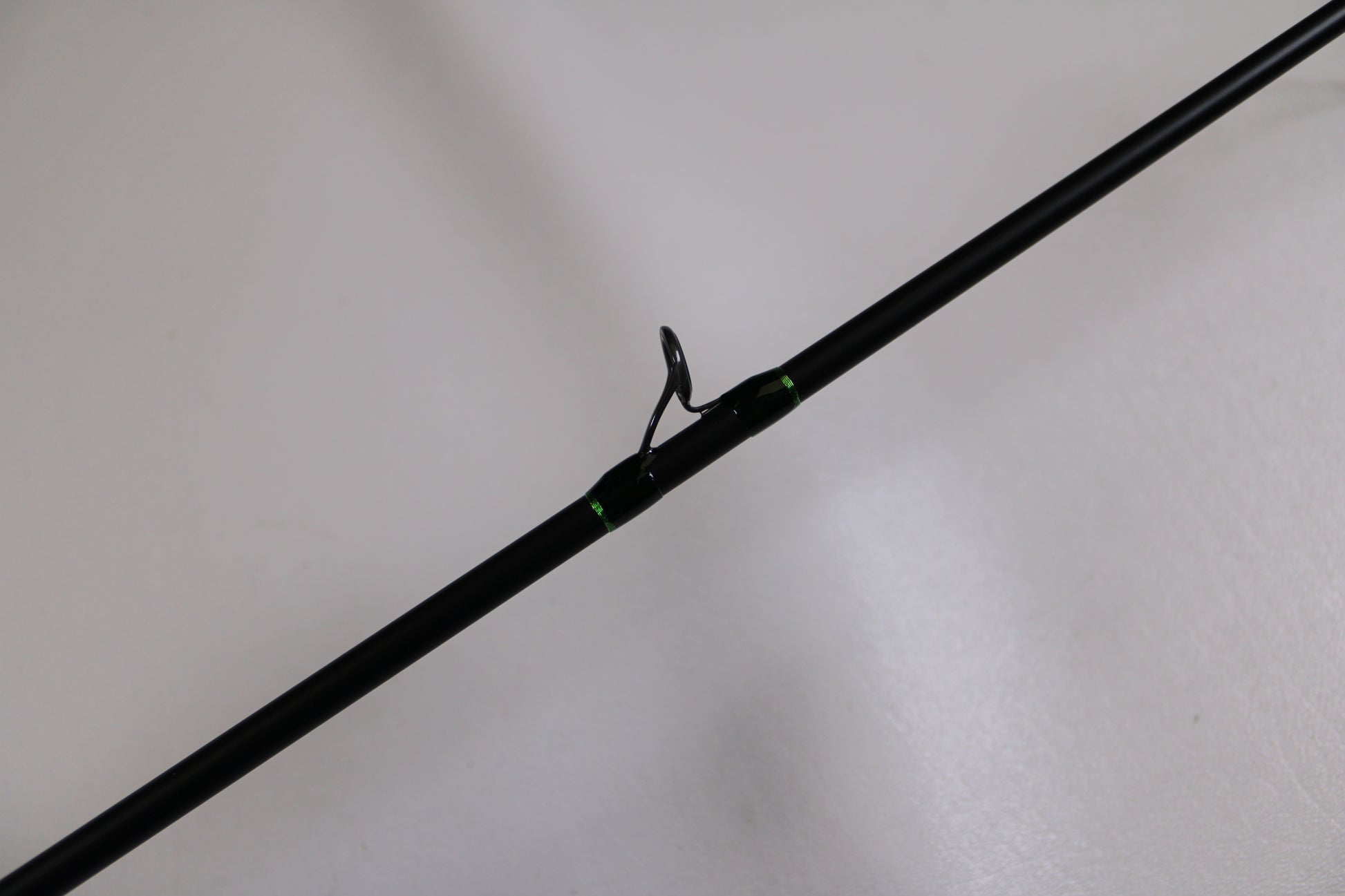 A close-up of the G. Loomis IMX-Pro 783C CBR Used Casting Rod in excellent condition, featuring a metal guide ring—ideal for buyers seeking used G. Loomis gear or participating in the Rod and Reel Trade-In Program for store credit.