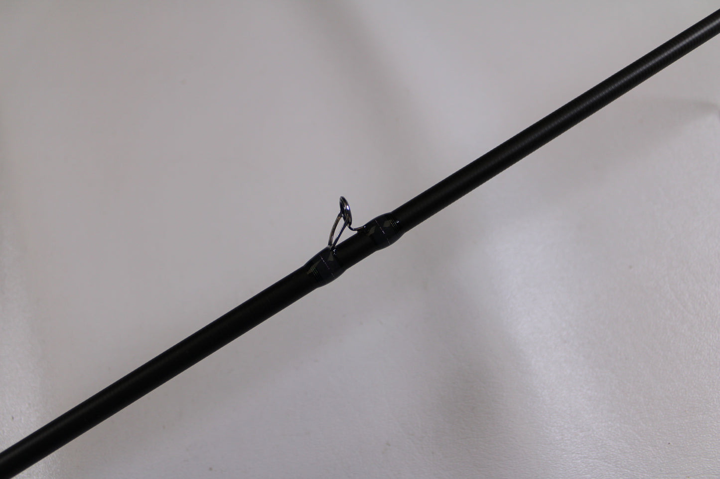 A close-up of the Megabass Destroyer P5 F4-66X Used Casting Rod in excellent condition, highlighting a single guide ring—ideal for those looking for quality used gear or trading in through our Rod and Reel Trade-In Program for store credit.