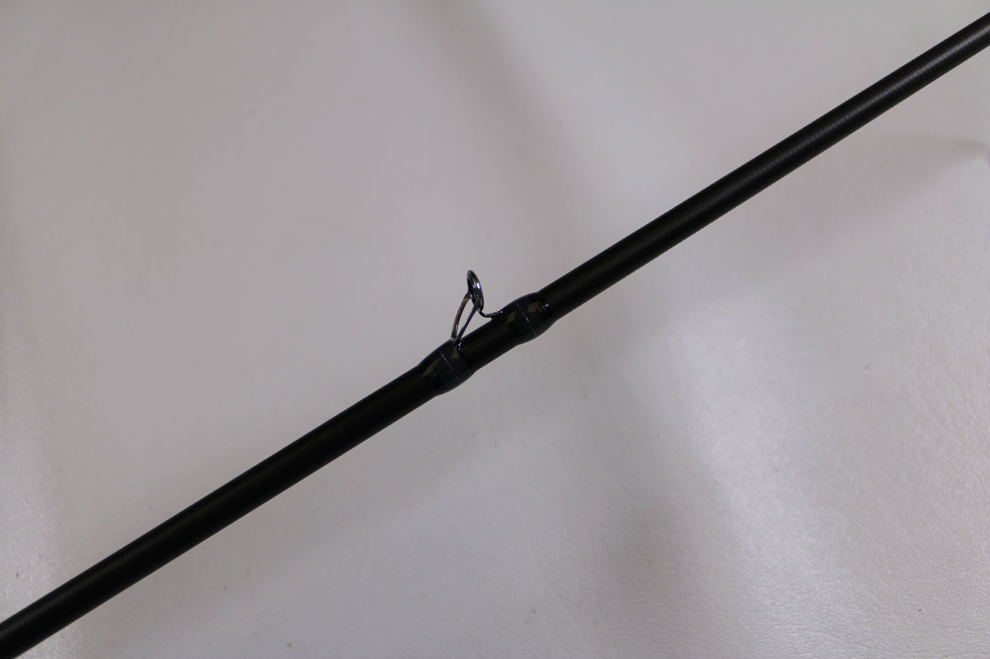 A close-up of the Megabass Destroyer P5 F4-66X Used Casting Rod in excellent condition, highlighting a single guide ring—ideal for those looking for quality used gear or trading in through our Rod and Reel Trade-In Program for store credit.