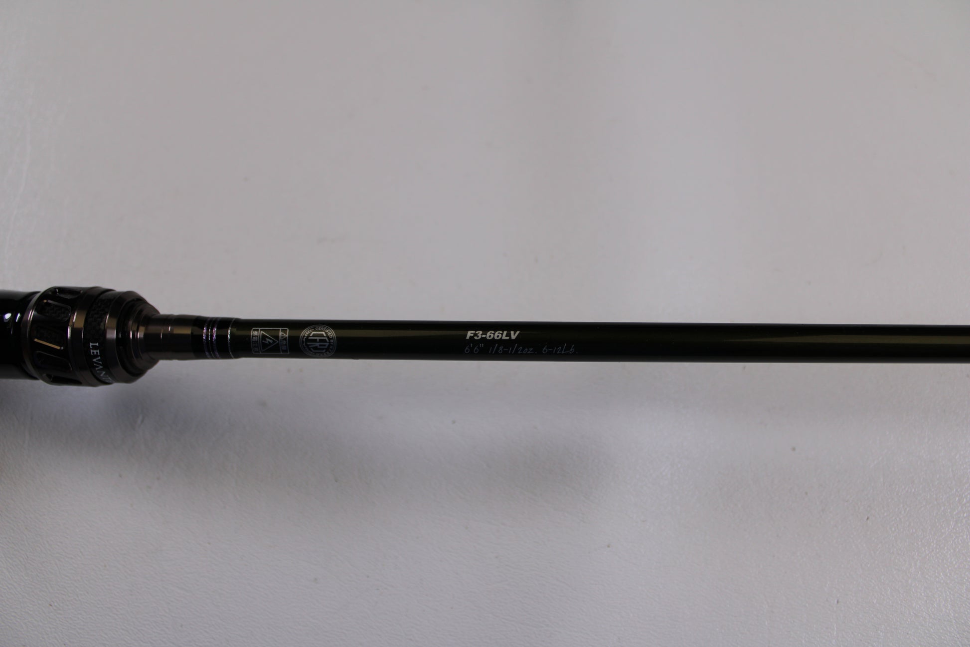 A close-up of the Megabass Levante F3-66LV Used Casting Rod in excellent condition, highlighting the handle and rod shaft—a top pick for fans of Megabass or those exploring our Rod and Reel Trade-In Program.