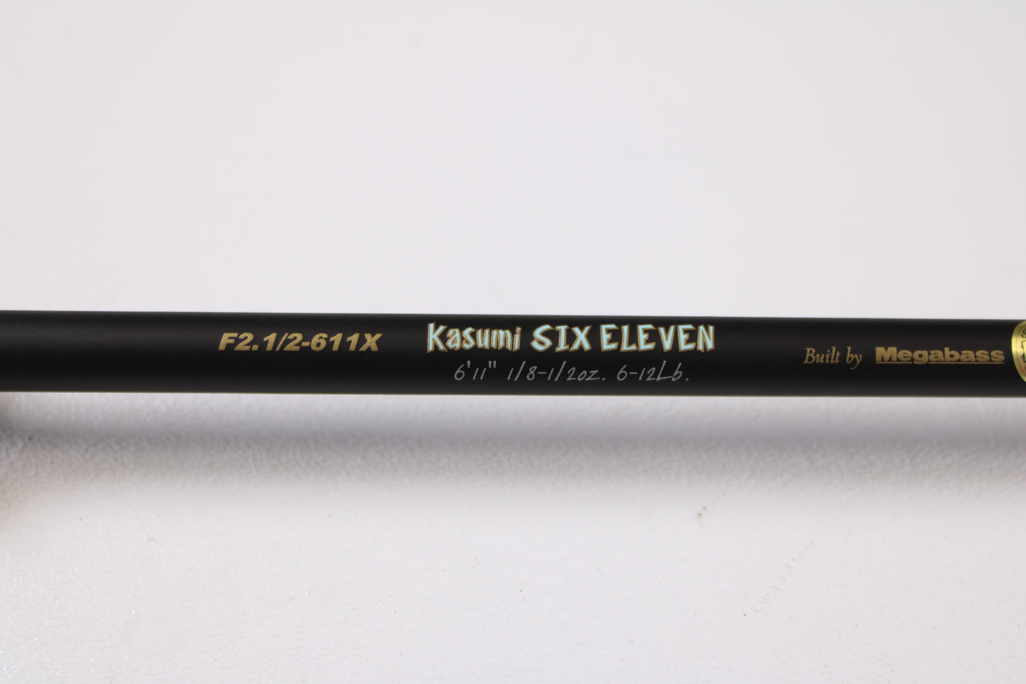 A close-up of the Megabass Destroyer P5 F2.1/2-611X Kasumi Six Eleven 6'11" Medium Light Used Casting Rod in excellent condition—ideal for our rod and reel trade-in program or used gear selection.