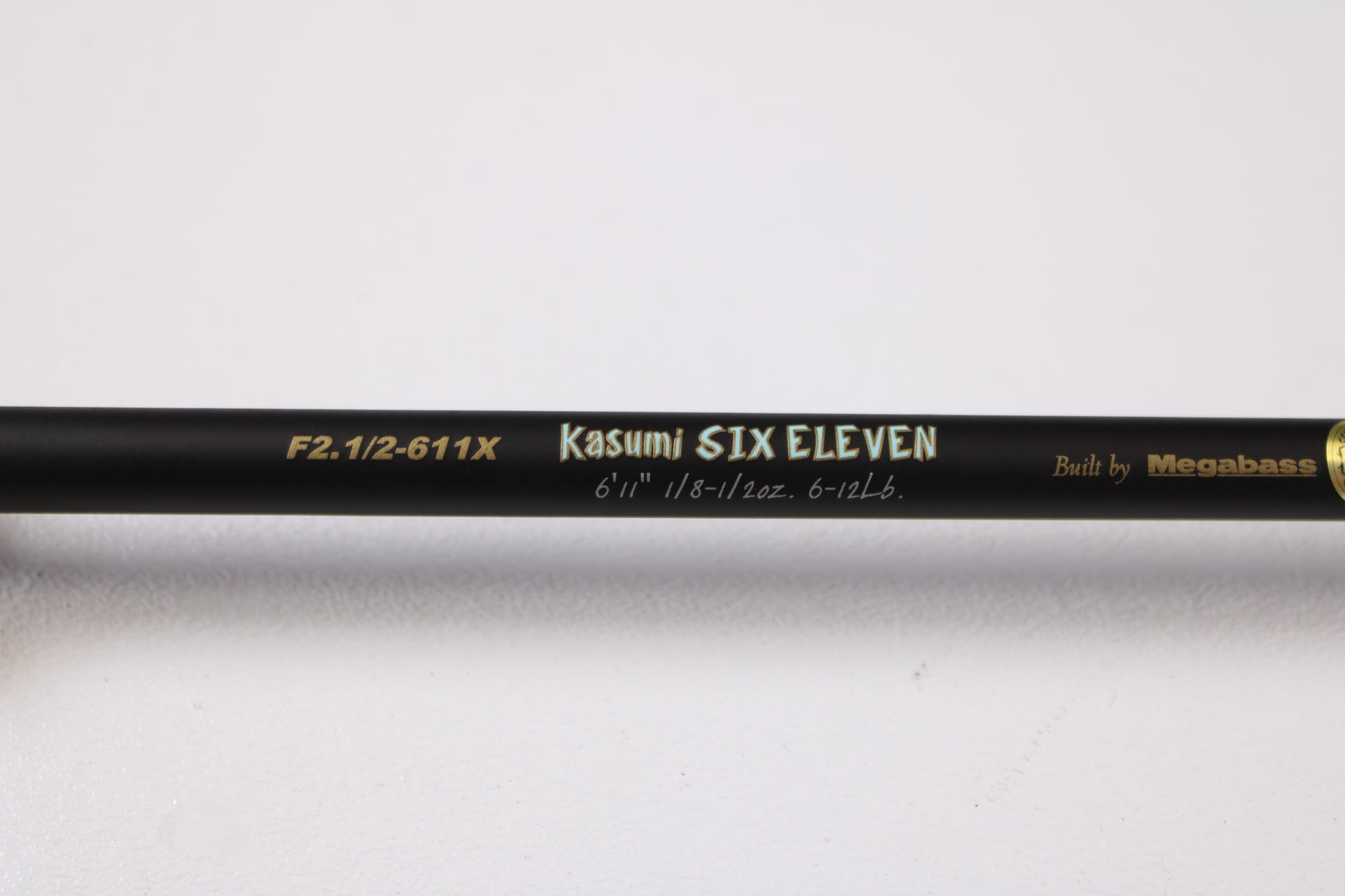 A close-up of the Megabass Destroyer P5 F2.1/2-611X Kasumi Six Eleven 6'11" Medium Light Used Casting Rod in excellent condition—ideal for our rod and reel trade-in program or used gear selection.
