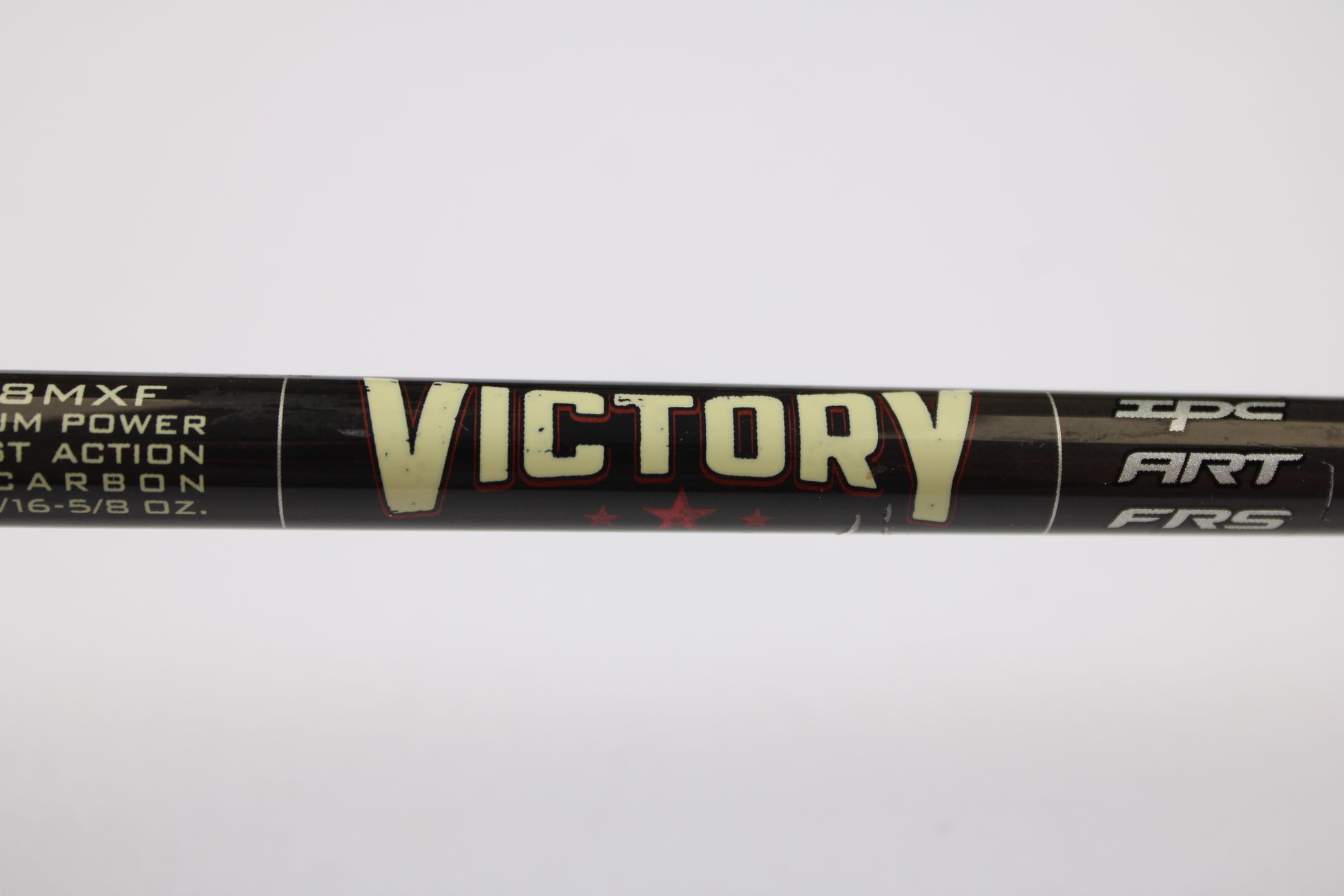 Close-up of a St. Croix Victory VTS68MXF Tactical 6'8" Medium Used Spinning Rod in excellent condition, black and labeled "VICTORY" in bold yellow. Ideal for those looking to trade in gear with our Rod and Reel Trade-In Program.