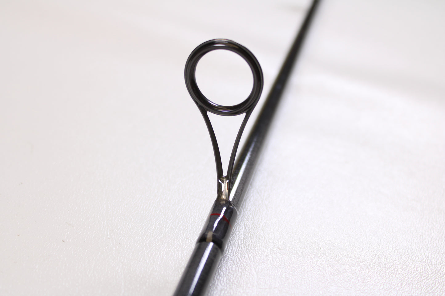 Close-up of a St. Croix Victory VTS68MXF Tactical 6'8" Medium used spinning rod in excellent condition, highlighting the circular line guide—ideal for upgrading through our Rod and Reel Trade-In Program.