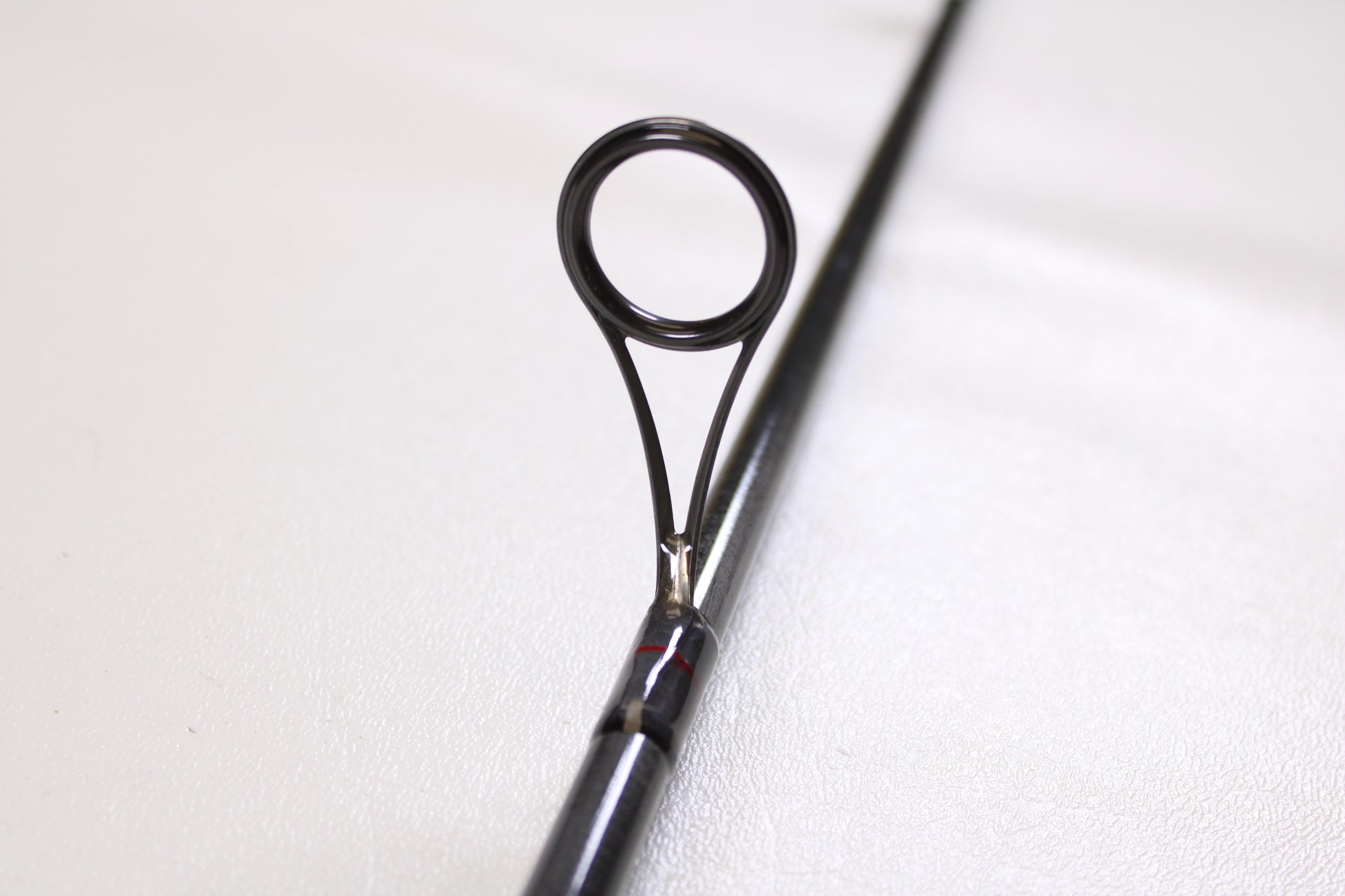 Close-up of a St. Croix Victory VTS68MXF Tactical 6'8" Medium used spinning rod in excellent condition, highlighting the circular line guide—ideal for upgrading through our Rod and Reel Trade-In Program.