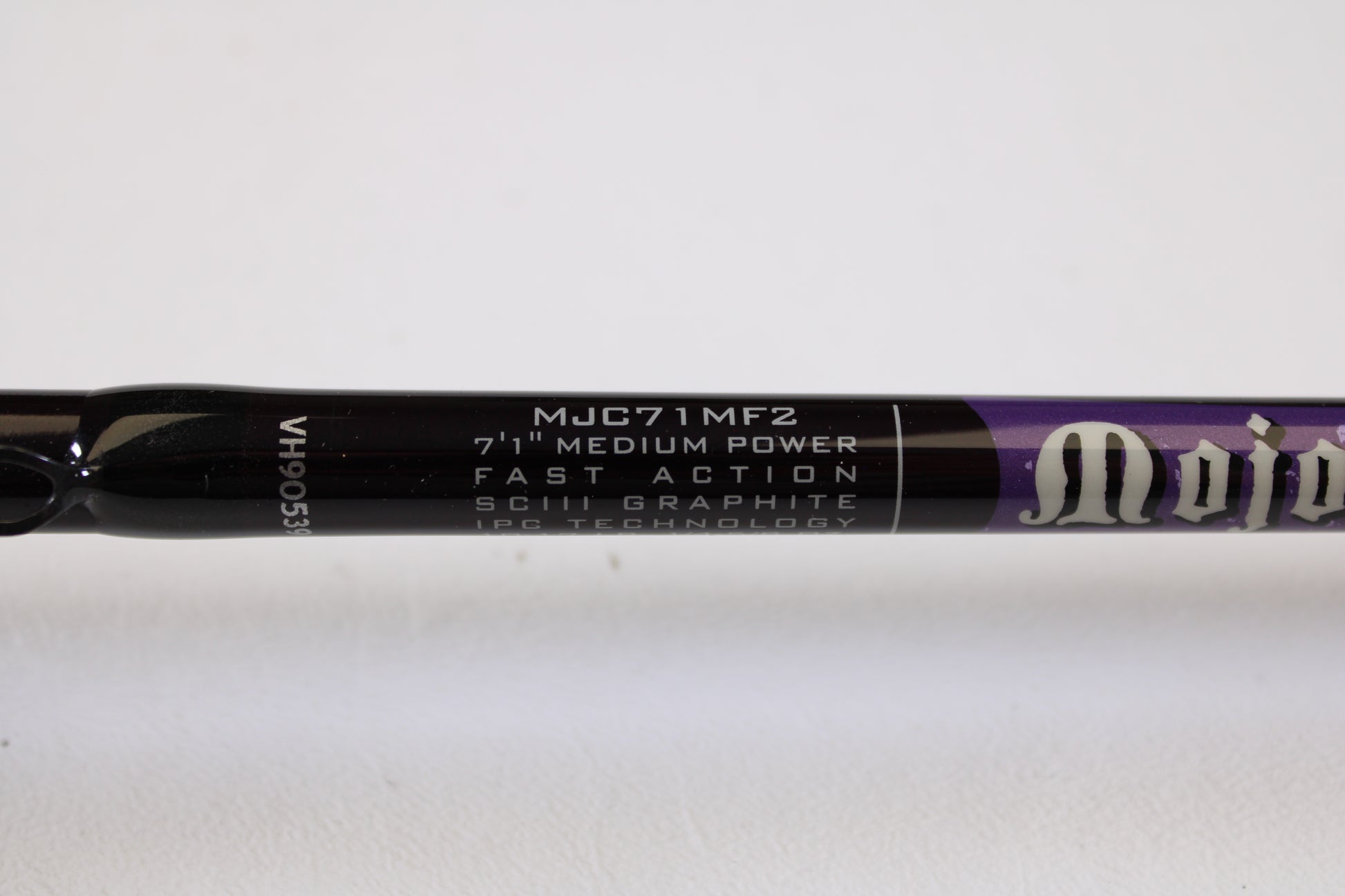 Close-up of a St. Croix Mojo Bass MJC71MF2 Plastics 7'1" Medium 2 Piece - Used Casting Rod (Excellent Condition), showing specs on the dark rod—eligible for our Rod and Reel Trade-In Program for store credit.