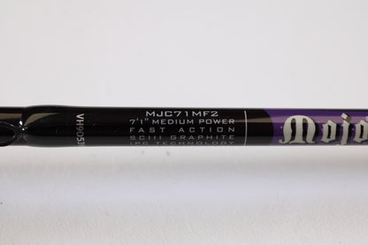 Close-up of a St. Croix Mojo Bass MJC71MF2 Plastics 7'1" Medium 2 Piece - Used Casting Rod (Excellent Condition), showing specs on the dark rod—eligible for our Rod and Reel Trade-In Program for store credit.