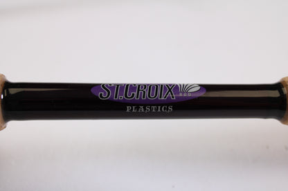 A close-up of the St. Croix Mojo Bass MJC71MF2 Plastics 7'1" Medium 2 Piece Used Casting Rod in excellent condition, perfect for upgrading your gear through our Rod and Reel Trade-In Program for store credit.