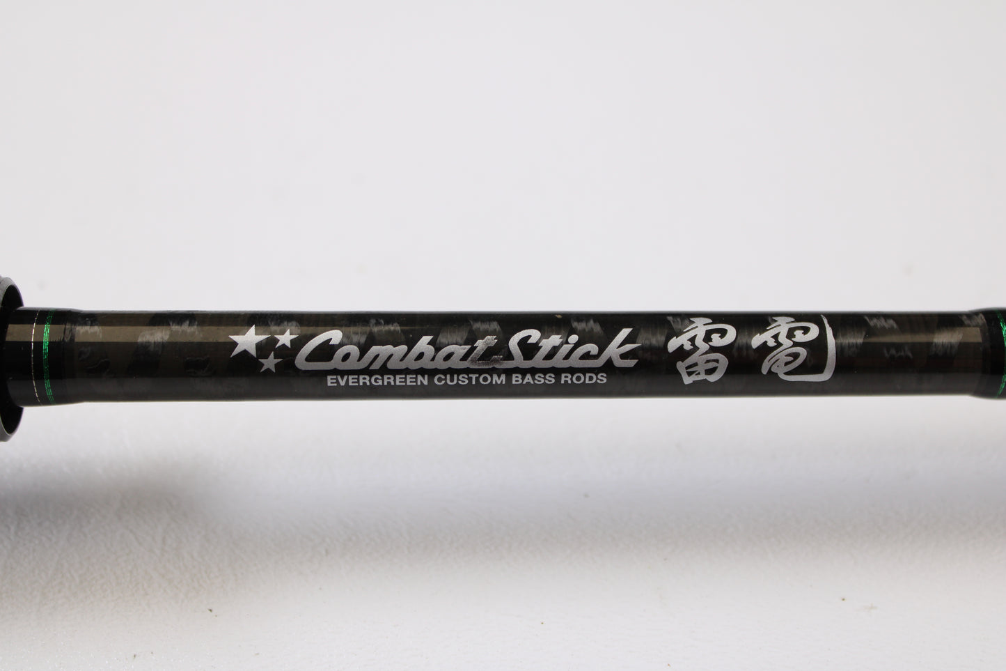 Close-up of an Evergreen International Combat Stick RCSC-71M Jerkbait & Squarebill 7'1" Medium Used Casting Rod in very good condition, featuring "Combat Stick" and Japanese text. Ideal for quality gear seekers or our Trade-In Program.