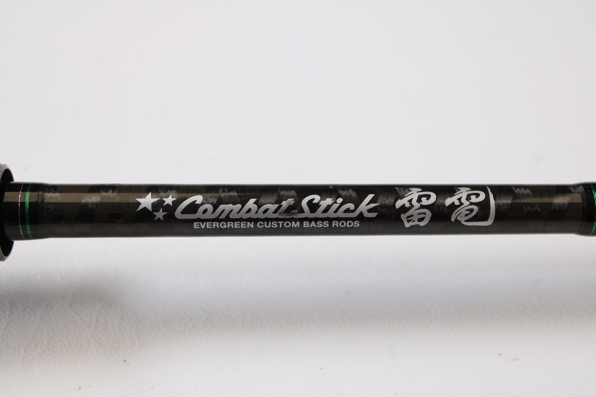 Close-up of an Evergreen International Combat Stick RCSC-71M Jerkbait & Squarebill 7'1" Medium Used Casting Rod in very good condition, featuring "Combat Stick" and Japanese text. Ideal for quality gear seekers or our Trade-In Program.