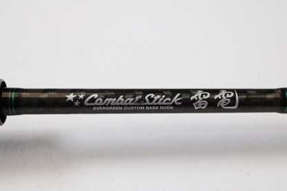 Close-up of an Evergreen International Combat Stick RCSC-71M Jerkbait & Squarebill 7'1" Medium Used Casting Rod in very good condition, featuring "Combat Stick" and Japanese text. Ideal for quality gear seekers or our Trade-In Program.