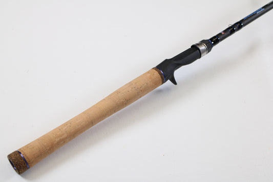 Close-up of a Dobyns Champion XP DC705CBGLASS 7'0" Medium Heavy Glass Used Casting Rod in excellent condition—perfect for those considering our Rod and Reel Trade-In Program or upgrading their used gear.