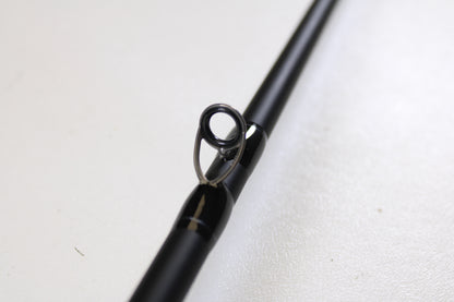 Close-up of a Dobyns Champion XP DC705CBGLASS 7'0" Medium Heavy Glass Used Casting Rod in excellent condition, showcasing its line guide—ideal for anglers seeking quality pre-owned gear from Dobyns.