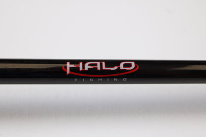 A close-up of a Halo Twilite HFTS711XHC 7'11" Extra Heavy Used Casting Rod in excellent condition shows "HALO" in red and "FISHING" in white on the blank—ideal for those interested in our rod and reel trade-in program for store credit.