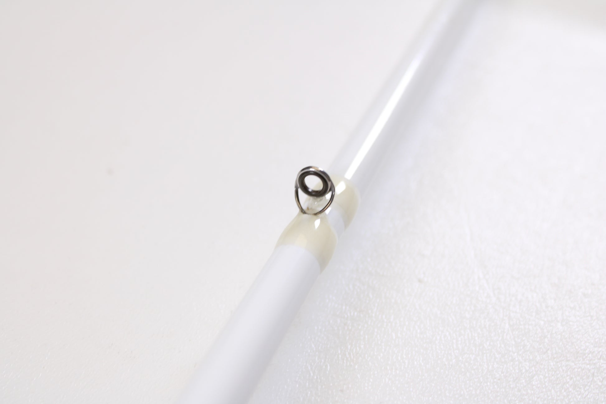 Close-up of a Duckett Pro Series DFPS74H-C Chris Lane 7'4" Heavy used casting rod in excellent condition, highlighting a single metal line guide with light wrap—ideal for anglers seeking quality pre-owned gear or considering a trade-in.