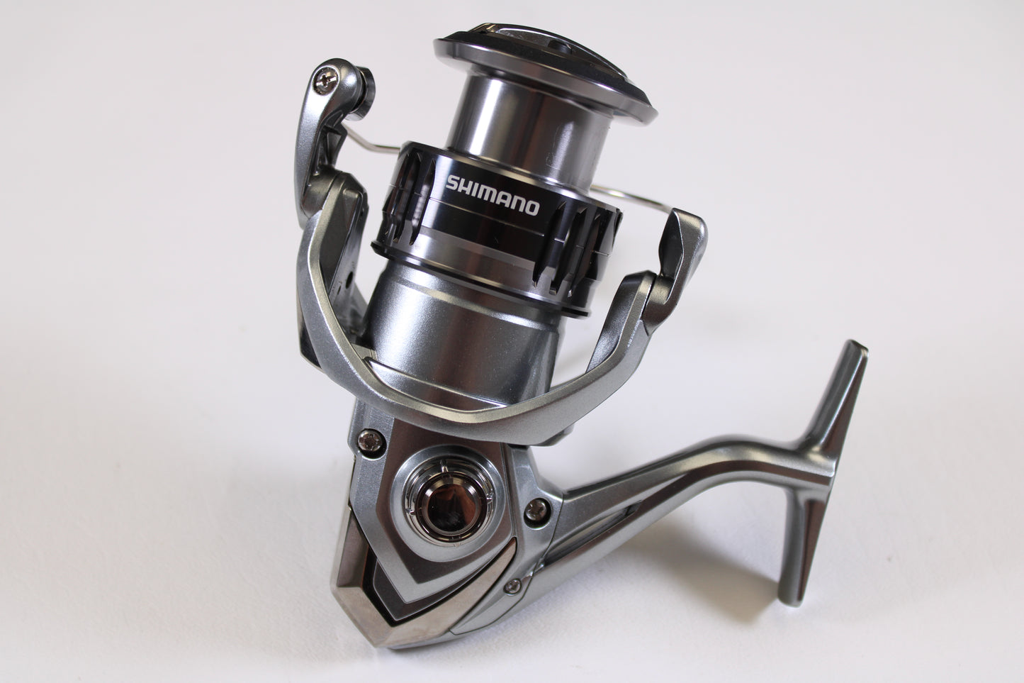 Close-up of a Shimano Nasci FC NAS4000XGFC 6.2:1 Used Spinning Reel in excellent condition on a white background—ideal for our Rod and Reel Trade-In Program if you’re ready to upgrade your Shimano gear.