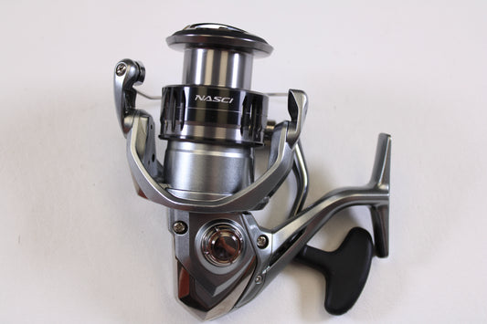 A close-up of a Shimano Nasci FC NAS4000XGFC 6.2:1 Used Spinning Reel in excellent condition—ideal for used gear enthusiasts or those wanting store credit with our Rod and Reel Trade-In Program.