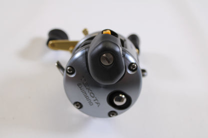 Close-up of a Shimano Tekota Line Counter 300LC TEK-300LC 4.2:1 RH Used Casting Reel in excellent condition, showing detailed front features and brand name—ideal for those interested in trading rods or reels for store credit.