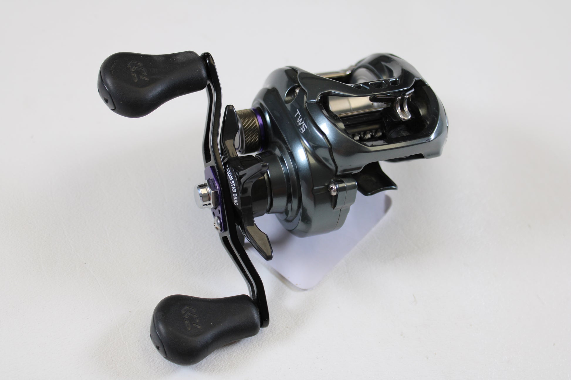A close-up of the Daiwa Tatula SV TW TTUSV103XS 8.1:1 RH casting reel in good used condition—ideal if you're interested in quality pre-owned gear or our rod and reel trade-in program.